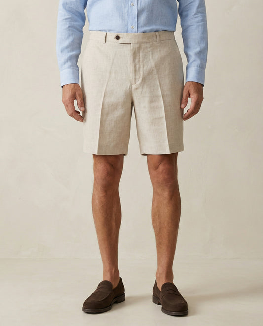 Detail of natural linen shorts fabric and tailored waistband