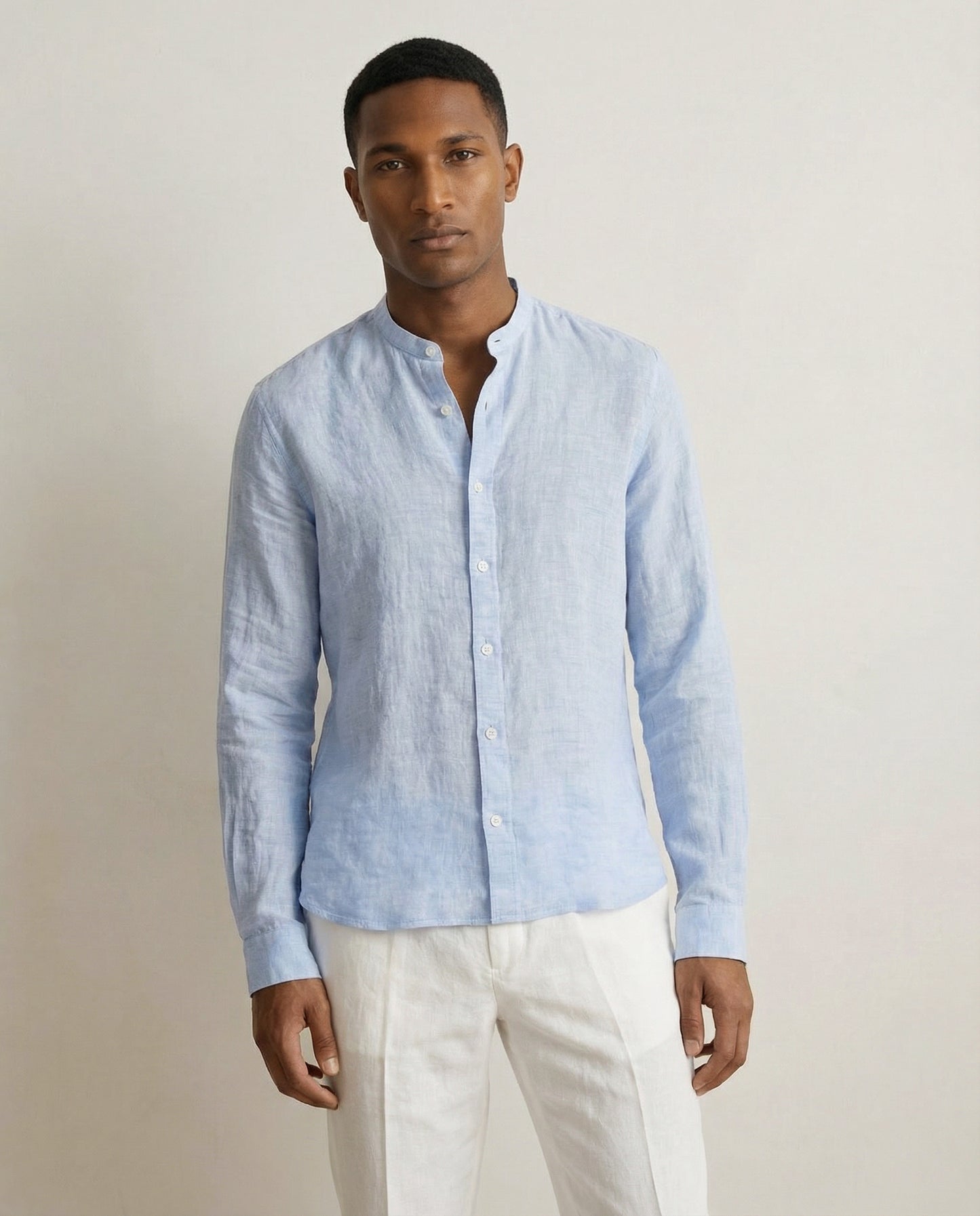 Mid crop view of men’s light blue linen Chinese collar shirt