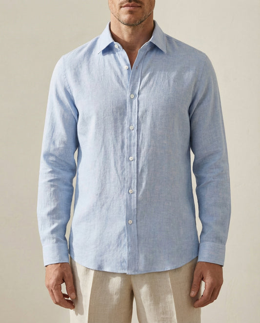 Close-up of light blue linen shirt fabric and button detailing