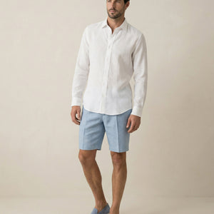 Men wearing white Akoya linen shirt styled for summer
