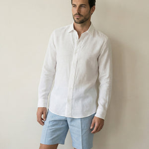 White Akoya linen shirt worn with tailored summer shorts