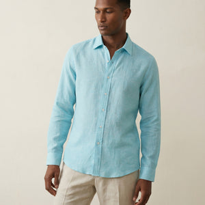 Mid-length view of men’s turquoise linen shirt with relaxed tailoring
