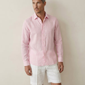 Mid view of men’s coral baby pink linen shirt showing fit and drape