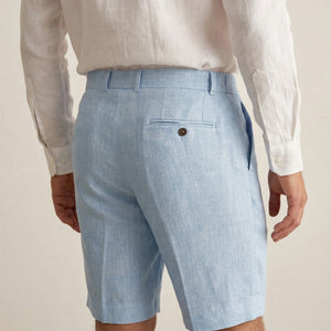 Back view of men’s light blue linen shorts with rear pocket