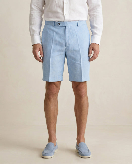 Detail of light blue linen shorts fabric and tailored waistband