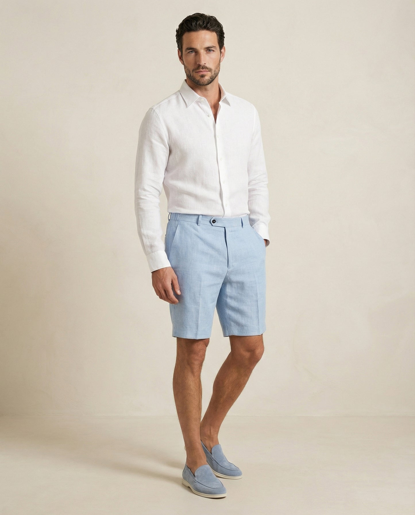 Men’s light blue linen shorts worn with white linen shirt, full outfit view