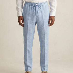 Front view of men’s light blue linen trousers