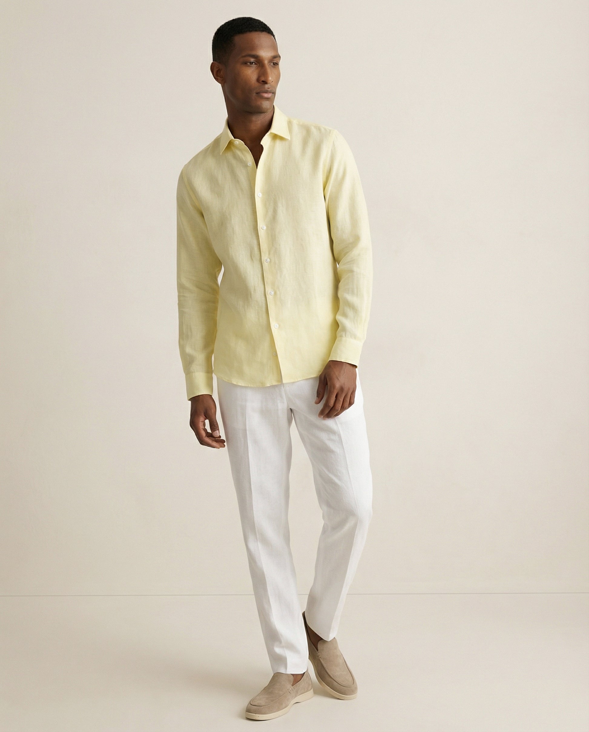 Men wearing light yellow linen shirt styled for summer resort wear