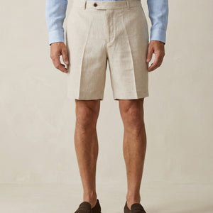 Detail of natural linen shorts fabric and tailored waistband