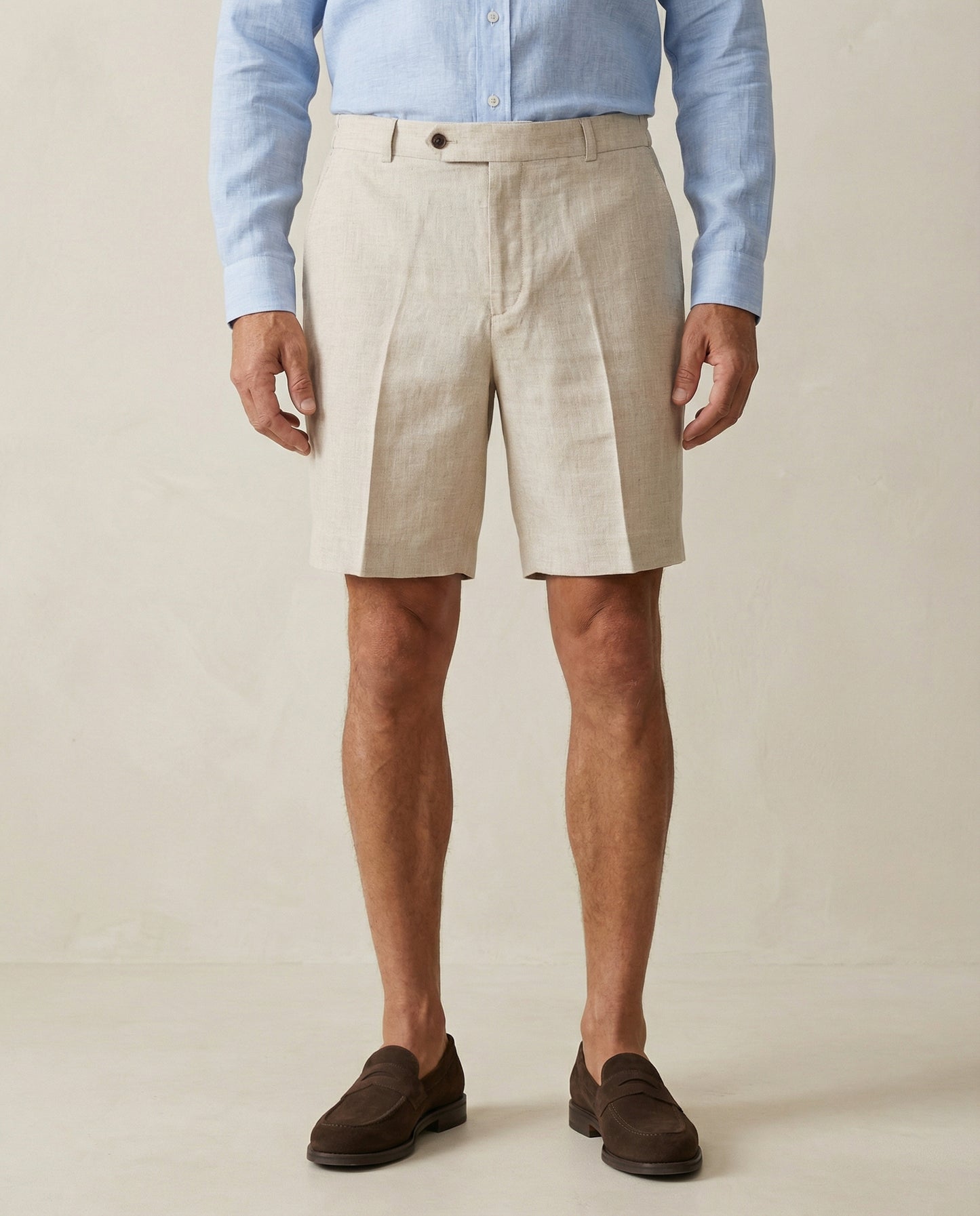 Detail of natural linen shorts fabric and tailored waistband