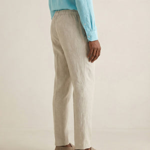 Back view of men’s natural linen trousers with elastic waistband