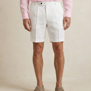 Close-up of linen fabric and construction on men’s pearl white shorts
