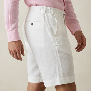 Side view of men’s pearl white linen shorts showing pocket and waistband