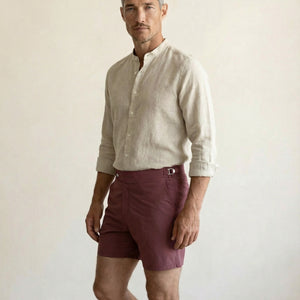 Front view of Riviera burgundy swim shorts featuring structured waistband and tailored silhouette.