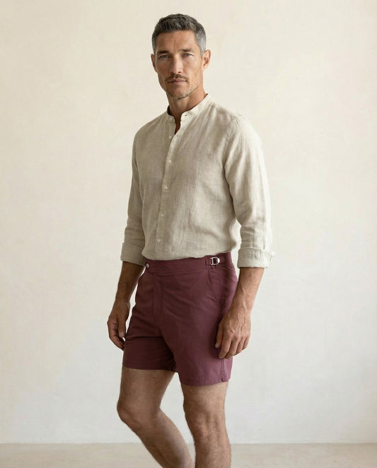 Front view of Riviera burgundy swim shorts featuring structured waistband and tailored silhouette.