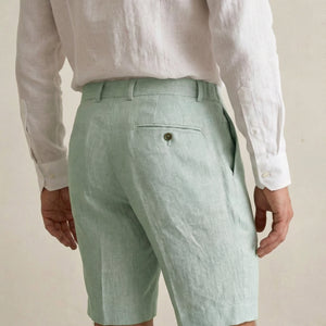 Back view of men’s sage green linen shorts with rear pocket