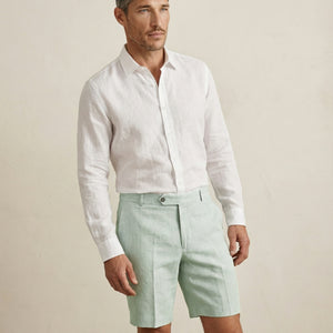 Front view of men’s sage green linen shorts