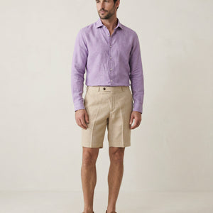 Men’s Senna beige linen shorts worn with purple linen shirt, full outfit view