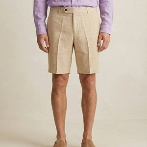 Detail of waistband and button closure on men’s linen shorts