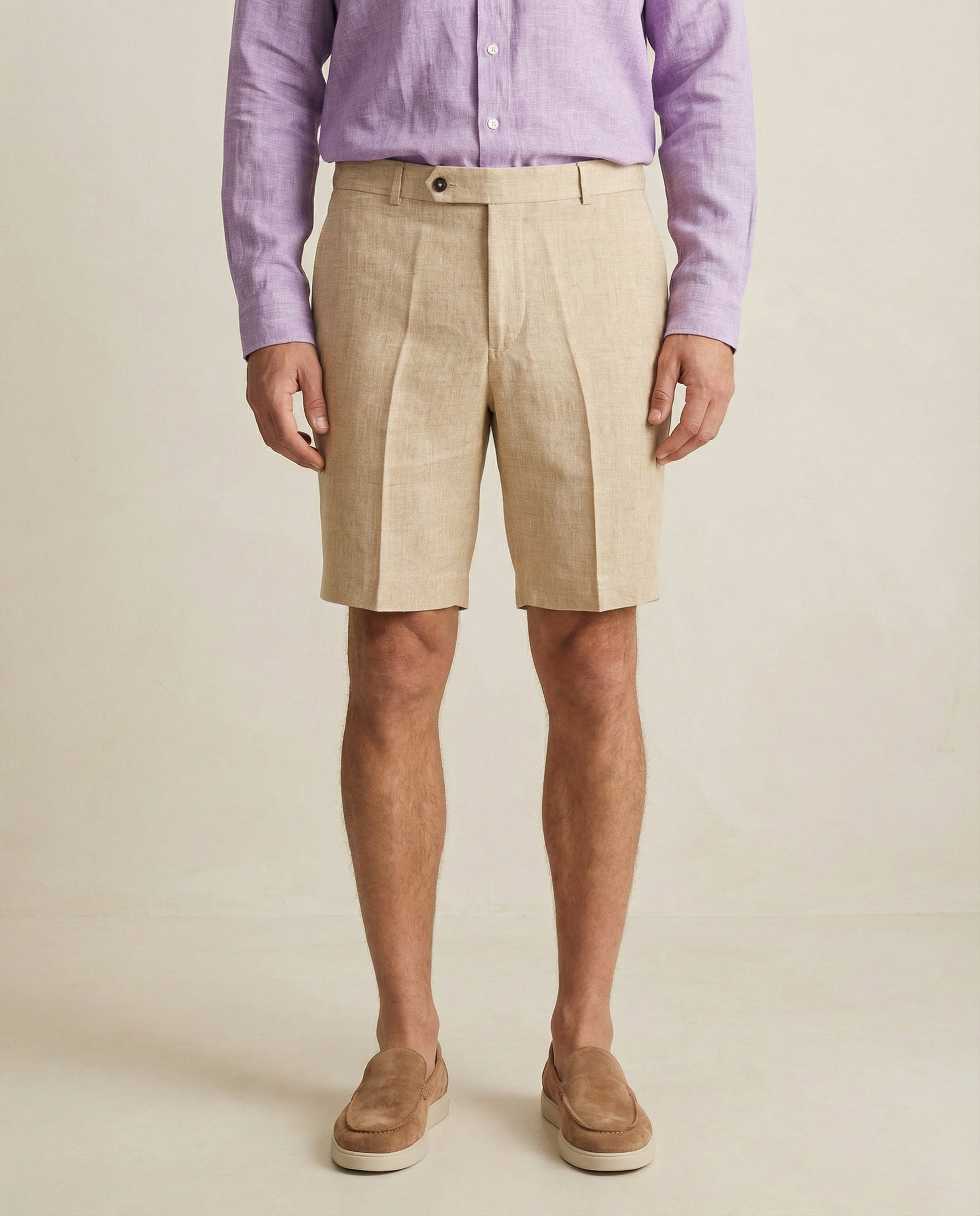 Detail of waistband and button closure on men’s linen shorts