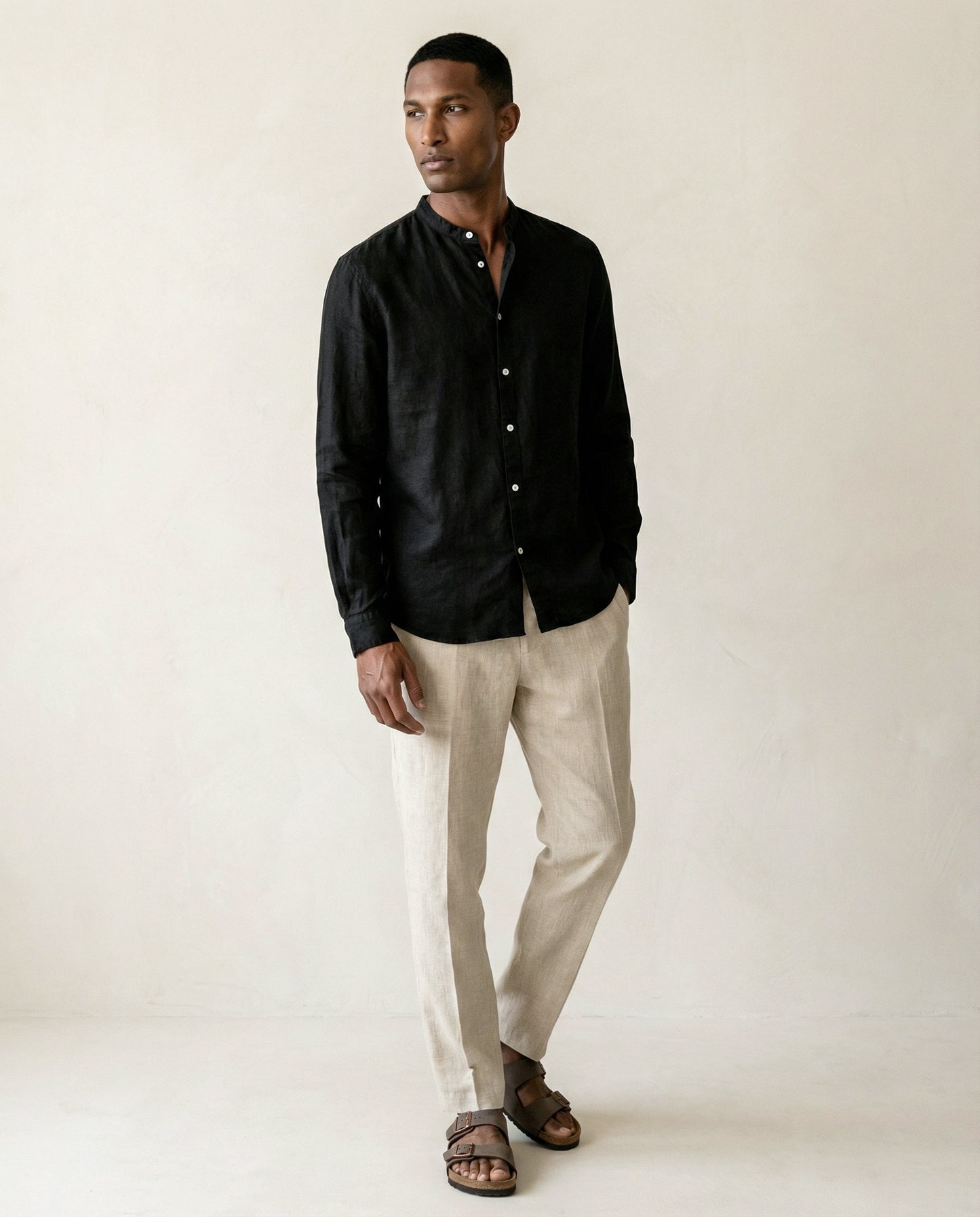 Full body view of men’s black linen shirt with Chinese collar