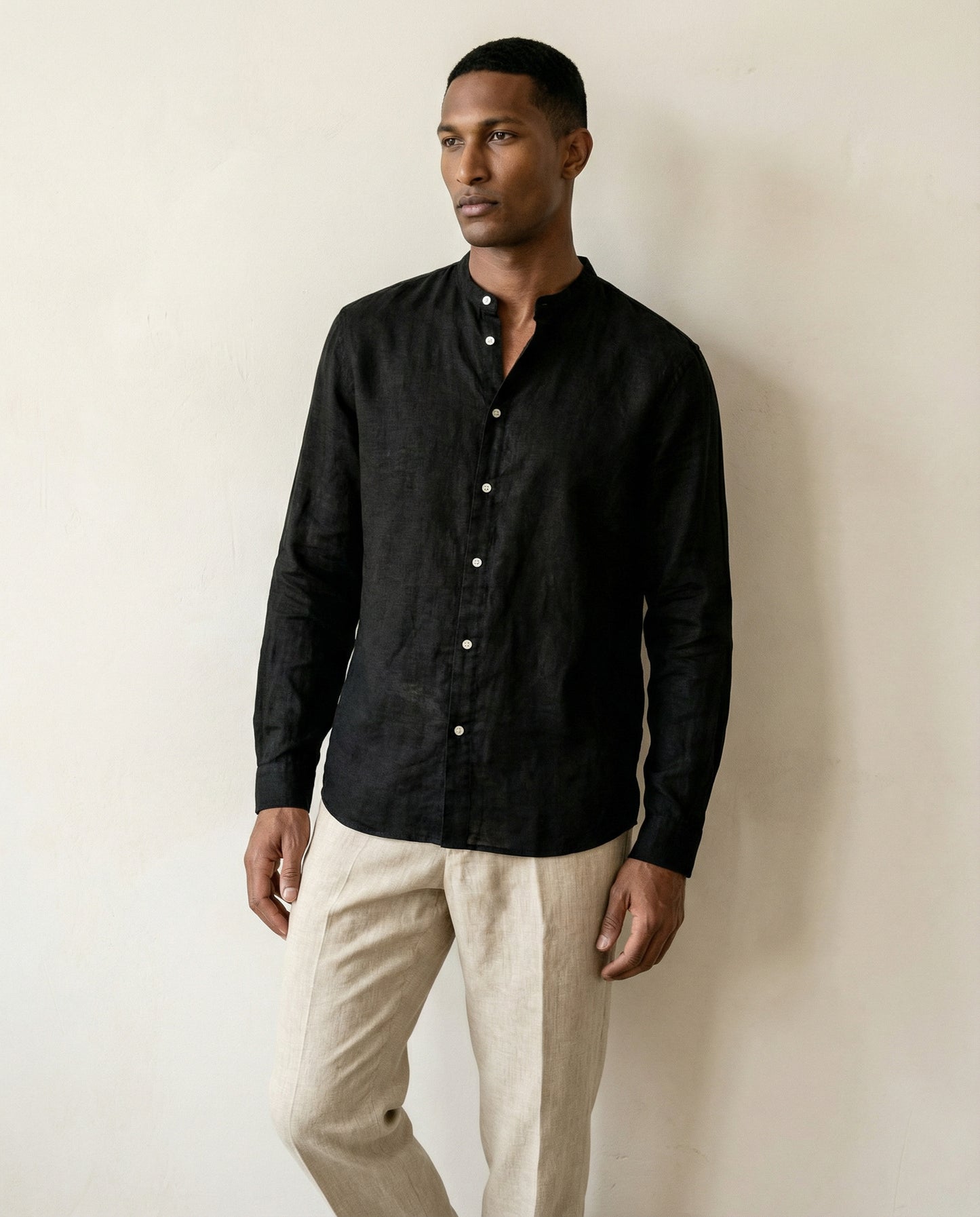 Mid view of men’s black linen shirt with stand collar