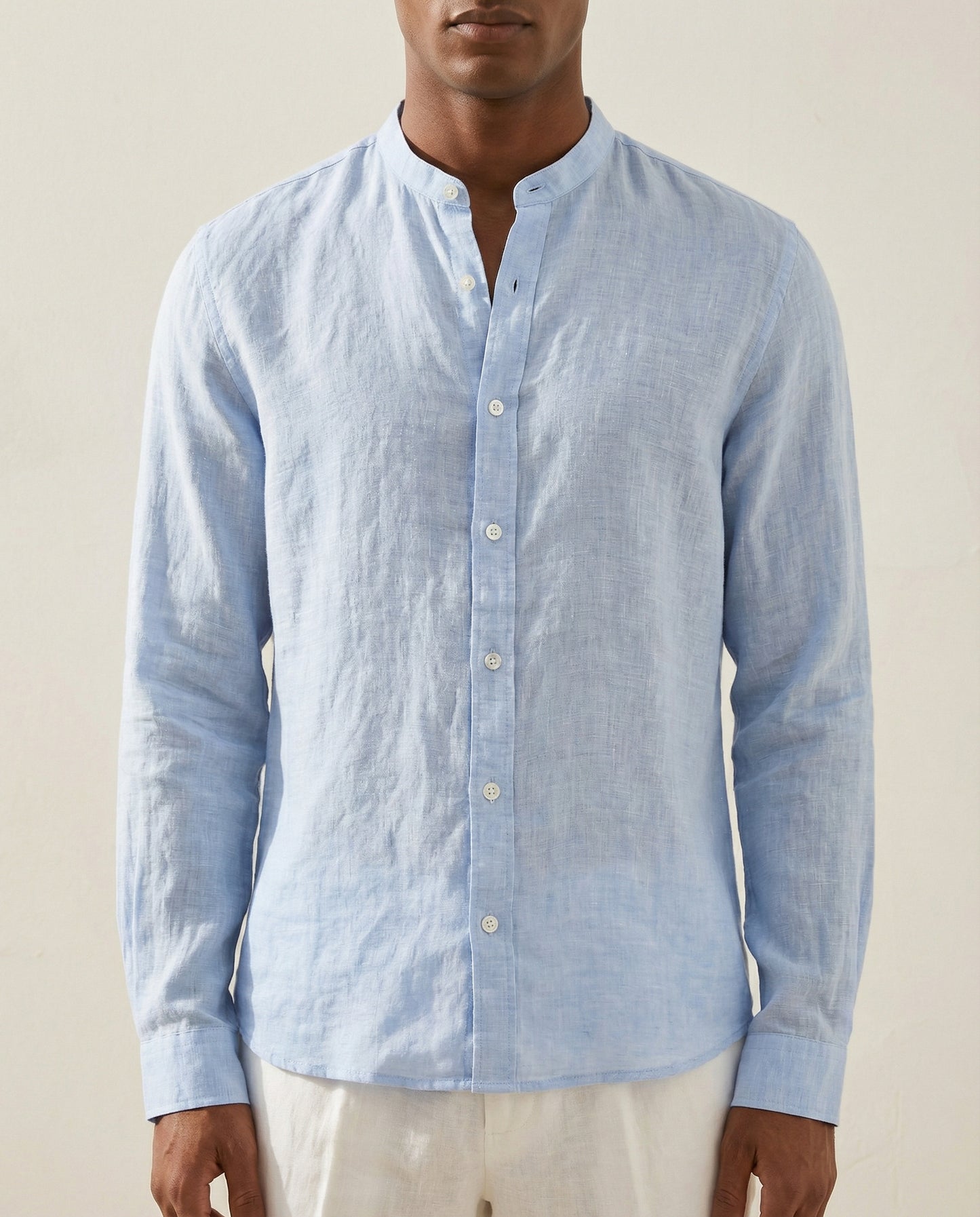 Detail view of light blue linen Chinese collar shirt with button placket